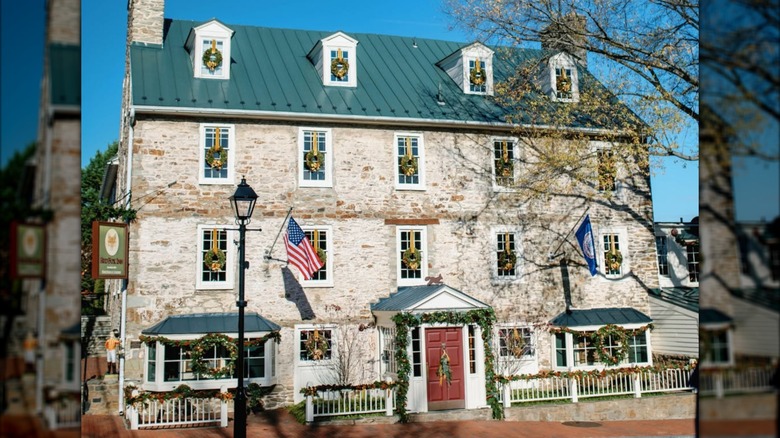 Exterior of the stone Red Fox Inn & Tavern building during the daytime