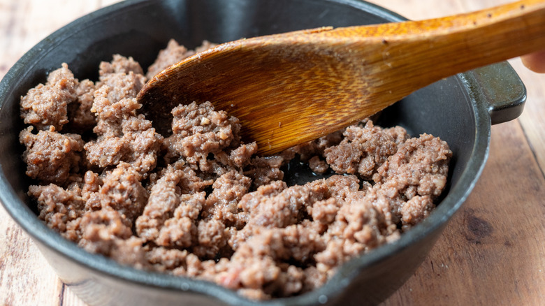 Cooked ground beef in a pan.