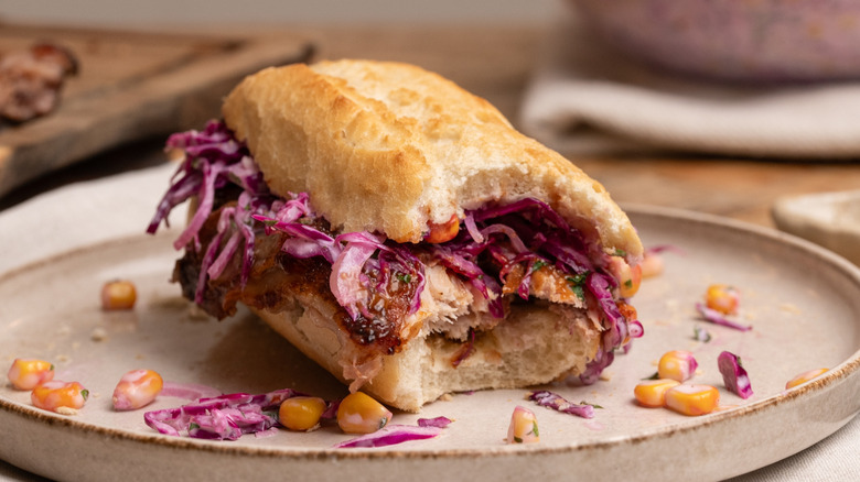 barbecue pork rib sandwich with bites taken