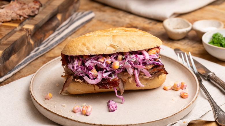 barbecue pork rib sandwich with slaw on plate