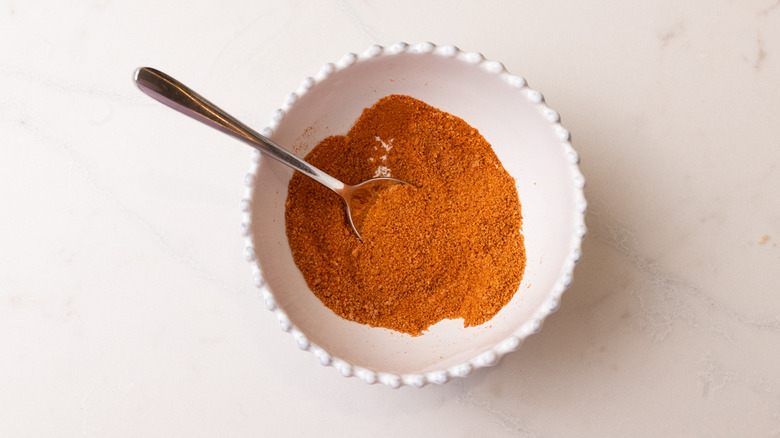 BBQ seasoning blend in bowl with spoon