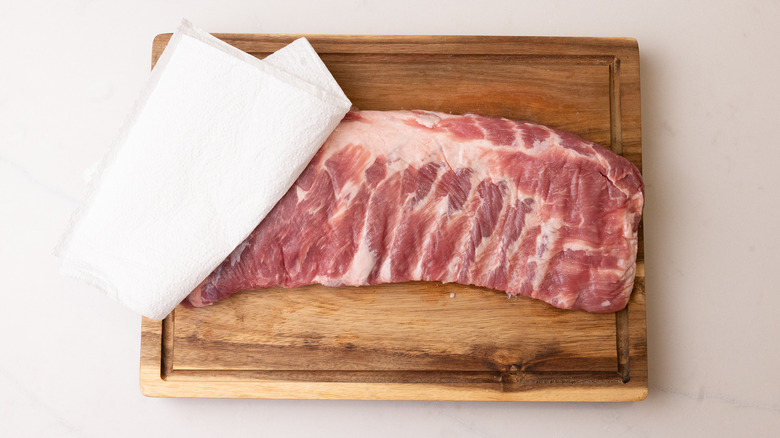 Paper towels on top of rack of ribs