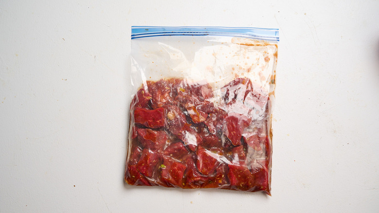 marinating beef in a plastic bag