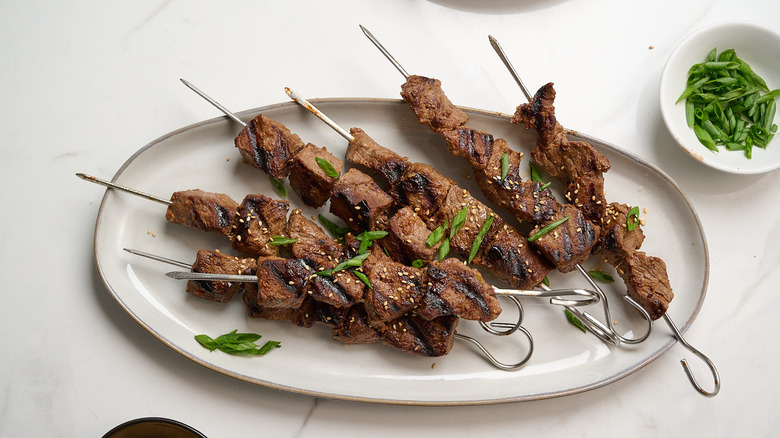 beef bulgogi kebabs on a platter