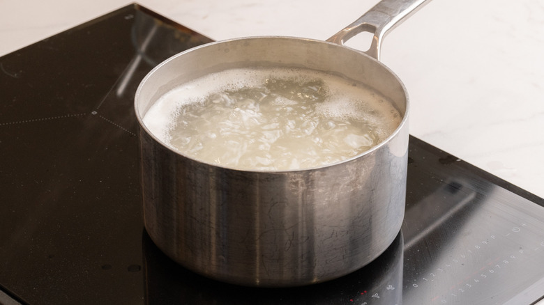 rice cooking in saucepan