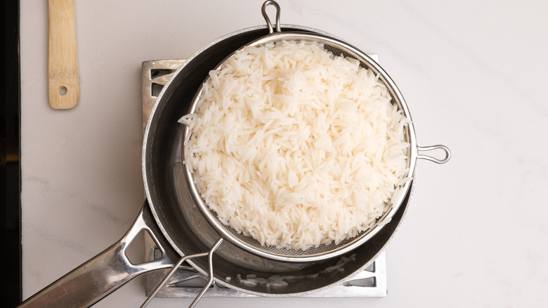 cooked rice in sieve