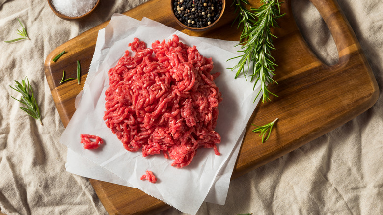 Raw ground beef on a chopping board