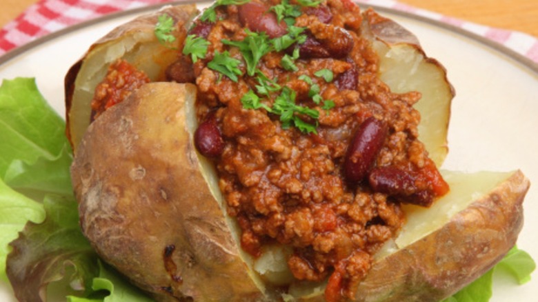 Baked potato topped with chili con carne