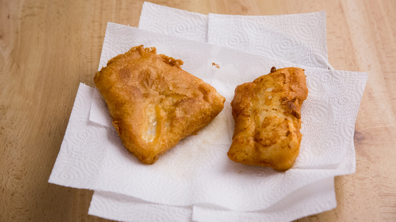 fried fish on paper towels