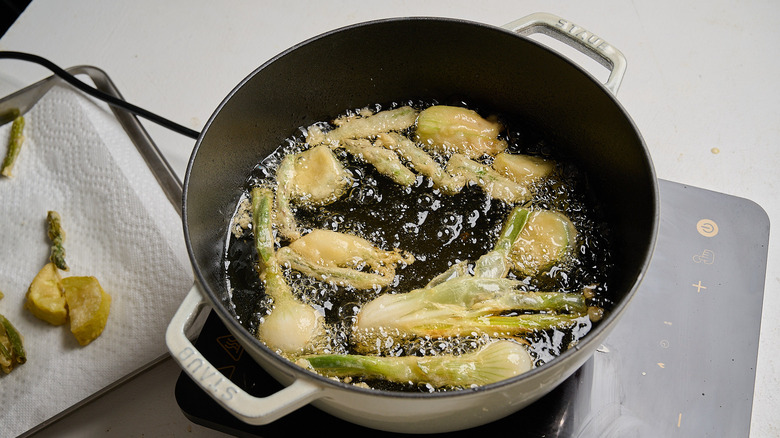 frying battered vegetables in oil