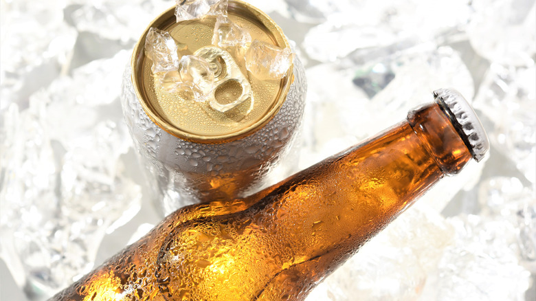 Unidentified beer bottle and beer can with ice