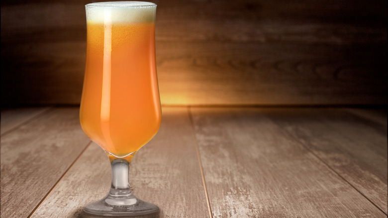 Hazy IPA on wooden table and background