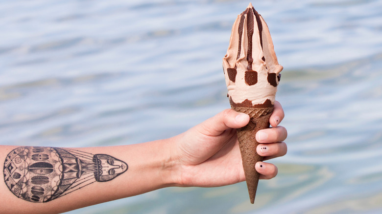 tattooed arm with ice cream