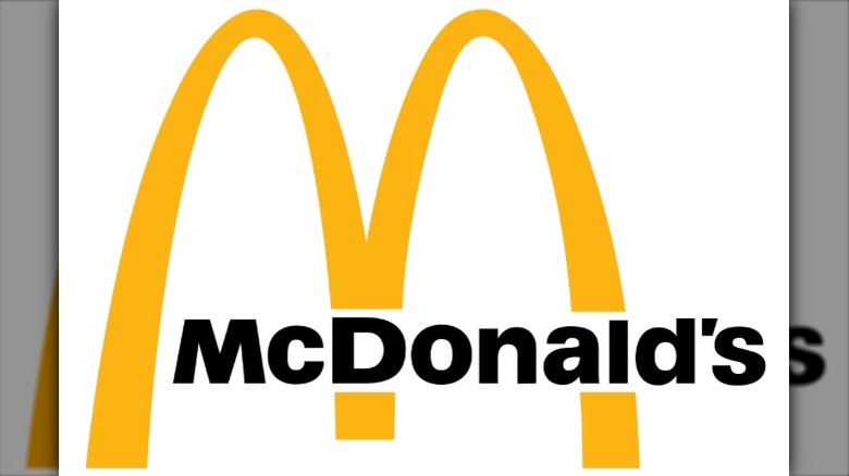 The 1968 McDonald's logo featuring the mustard-yellow arches with the company name written in black font