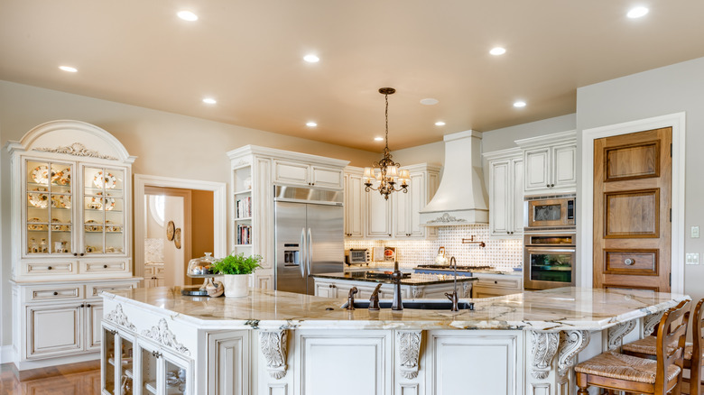 French country style kitchen recessed lights and a classic chandlier