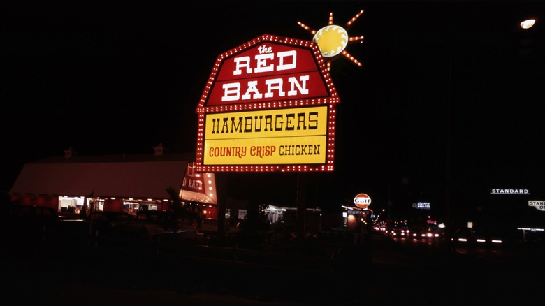 The Red Barn fast food restaurant exterior at night