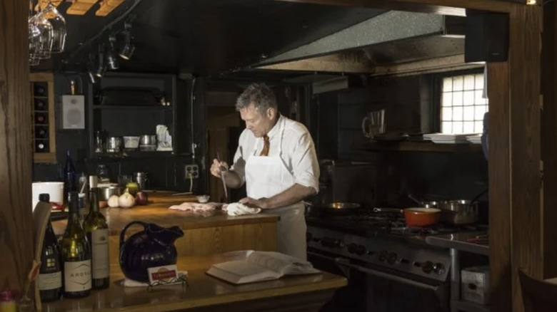 Image inside of TJ Buckley's Brattleboro restaurant chef preparing a dish