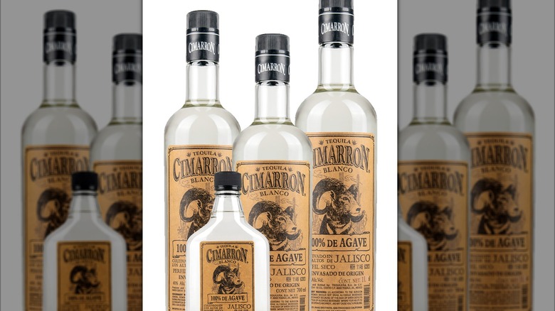 several bottles of Cimarron Blanco standing together on white background