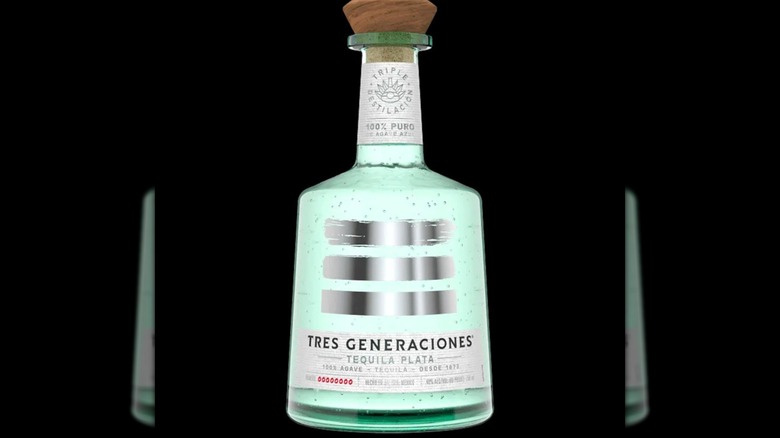 Tres Generaciones bottle on black background