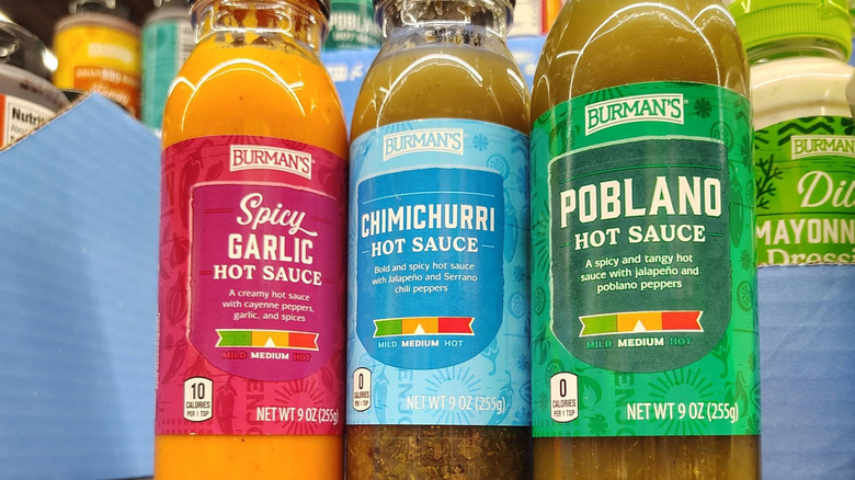 bottles of Burman's sauces on Aldi shelf