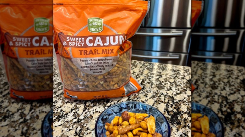 bag of Southern Grove Cajun Trail Mix on kitchen counter next to bowl