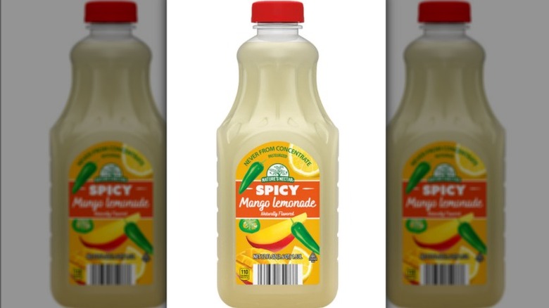Bottle of spicy mango lemonade on white background