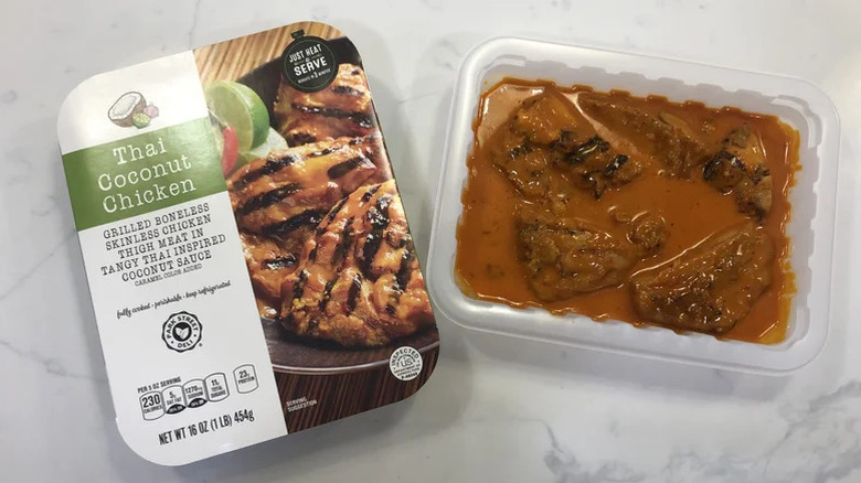 Aldi's Thai Coconut chicken sits next to its box on a marble countertop