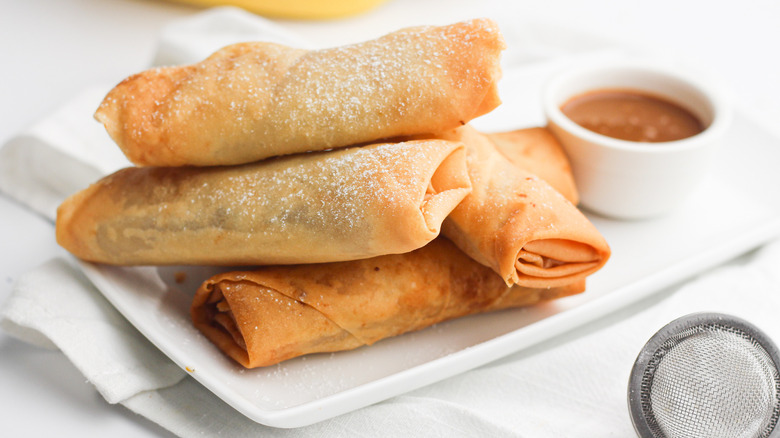 banana lumpia stacked on plate