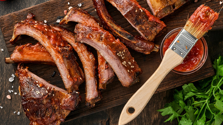barbecue ribs on wooden board 
