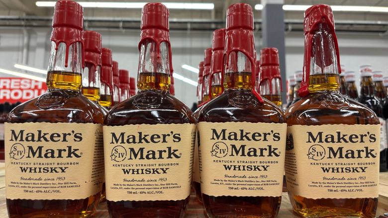 Rows of Maker's Mark bourbon shown on a brightly lit shelf