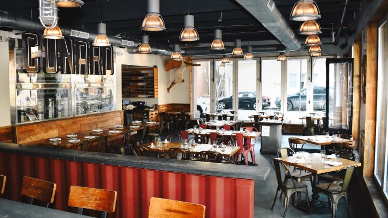 Interior of Cunard Tavern with bar seating and tables