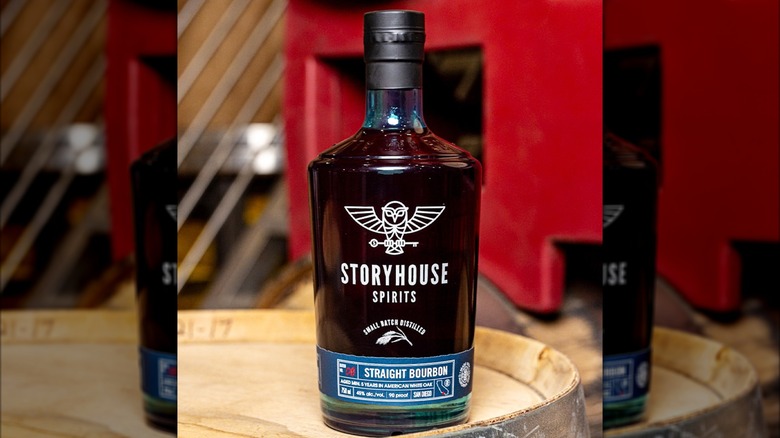 Bottle of Storyhouse Spirits Straight Bourbon on barrel