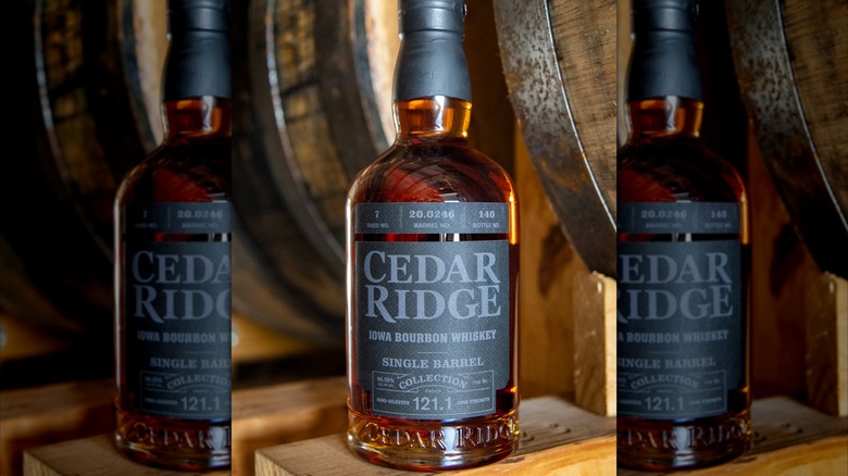 Bottle of Cedar Ridge bourbon on barrel rack
