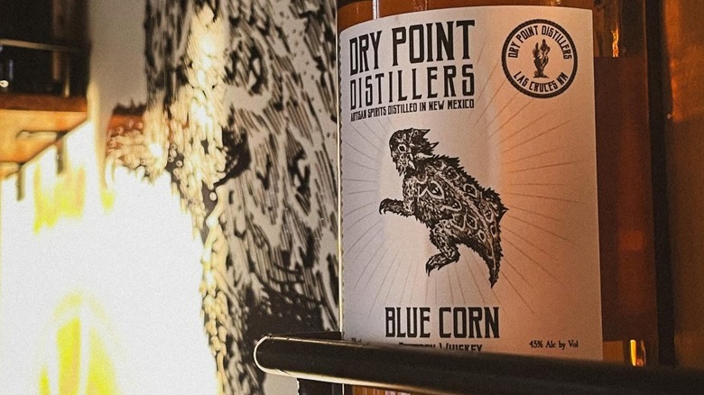 Bottle of blue corn bourbon with close-up on label