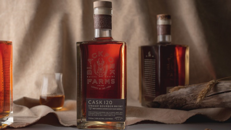 Bottles and glasses of BlackFork bourbon