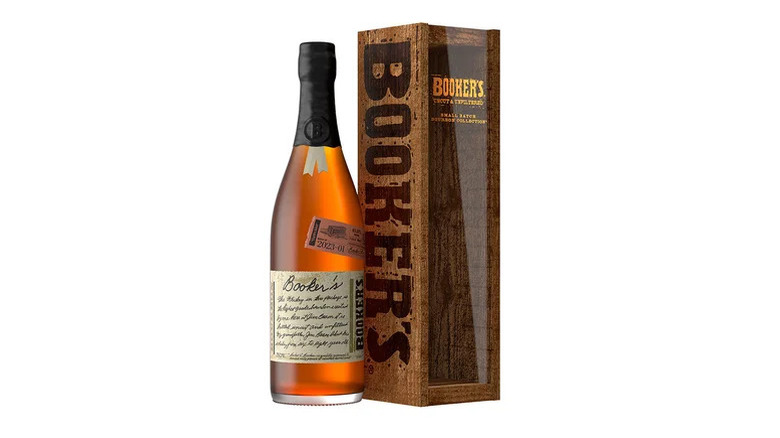 Booker's bourbon bottle and wooden case against a white background