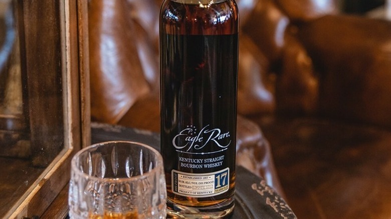 Eagle Rare bottle and glass in a lounge room