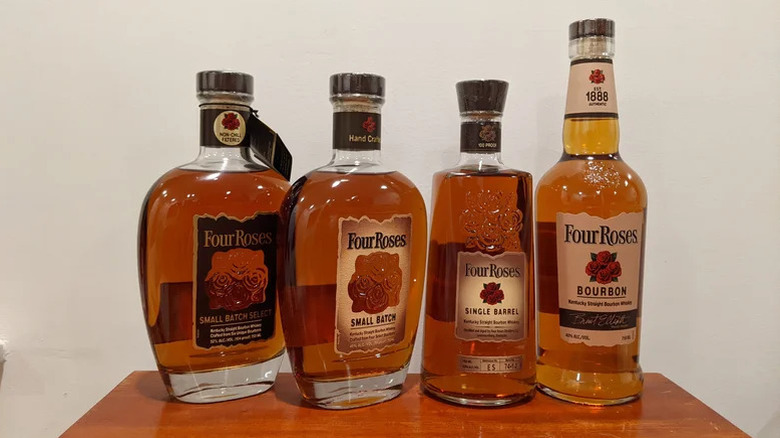 Four Roses bourbon bottles lineup on a table