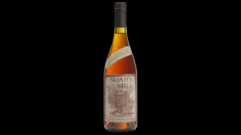 Noah's Mill bourbon bottle against a black background