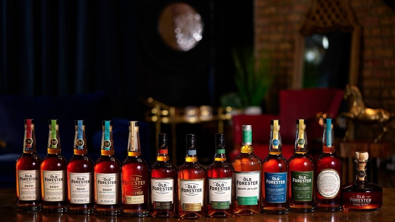 Old Forester bourbon bottles lineup on a table