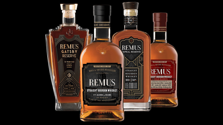 Remus bourbon bottles lineup against a black background