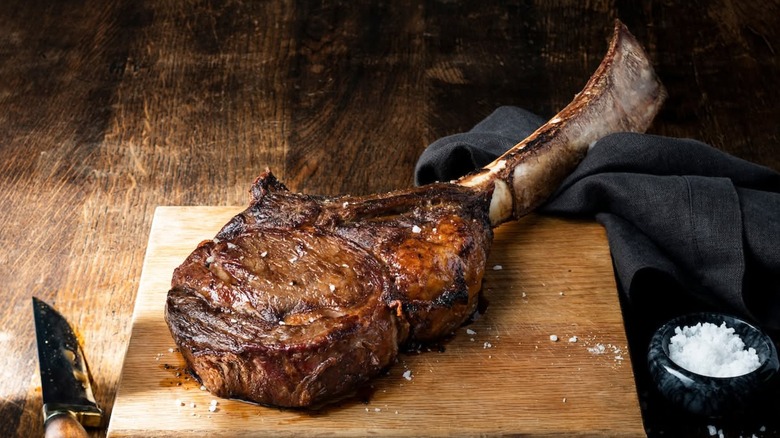 Tomahawk steak on a wooden board