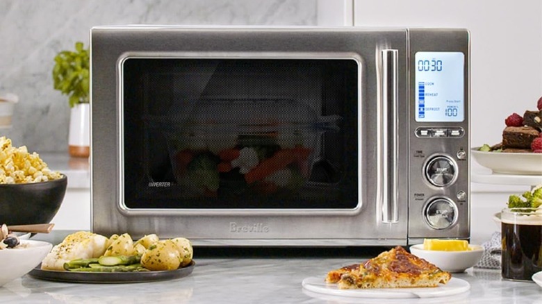A Breville Smooth Wave countertop microwave oven