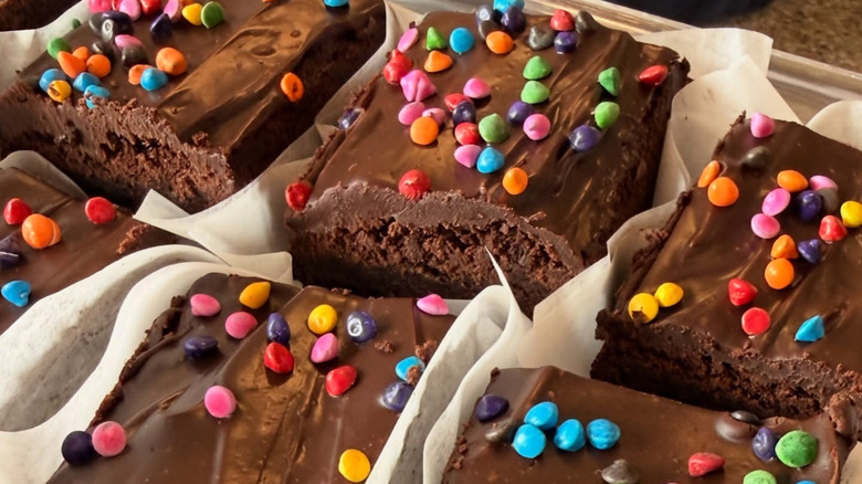 Several individually portioned cosmic brownies topped with colorful candy bits