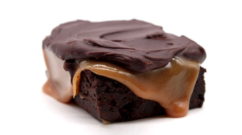 Brownie slathered with caramel and ganache