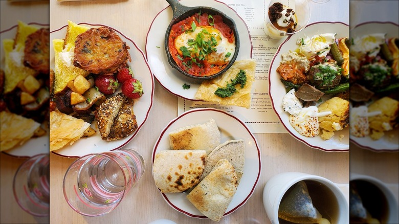 Asortment of dishes from Safta on white plates