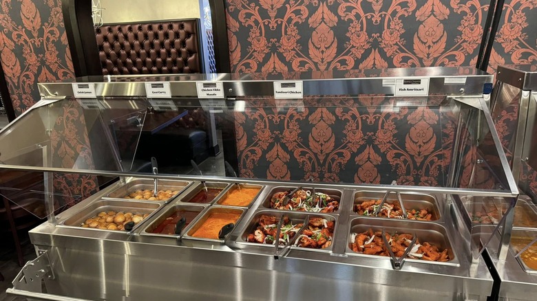 Metal buffet of colorful Indian food