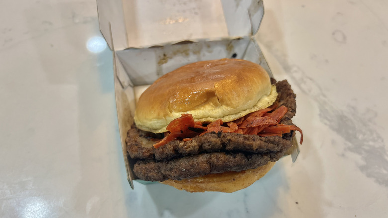Wahlburger's pepperoni smash burger in a to-go package