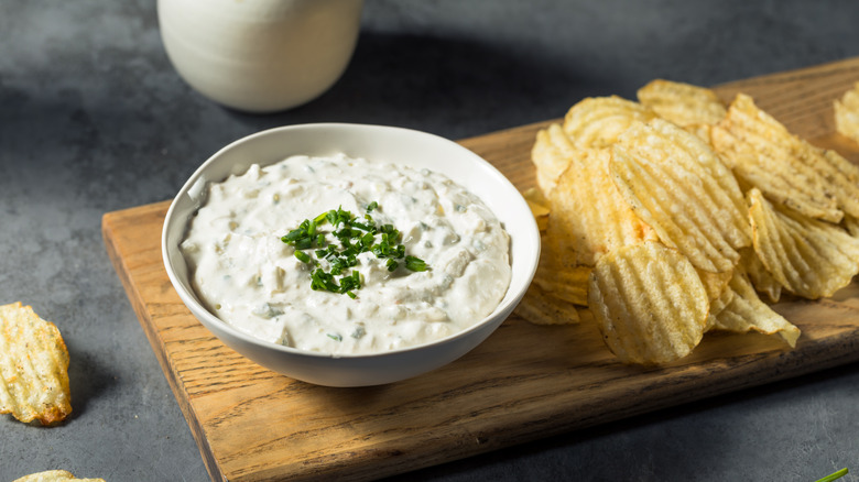 A bowl of onion dip with chips