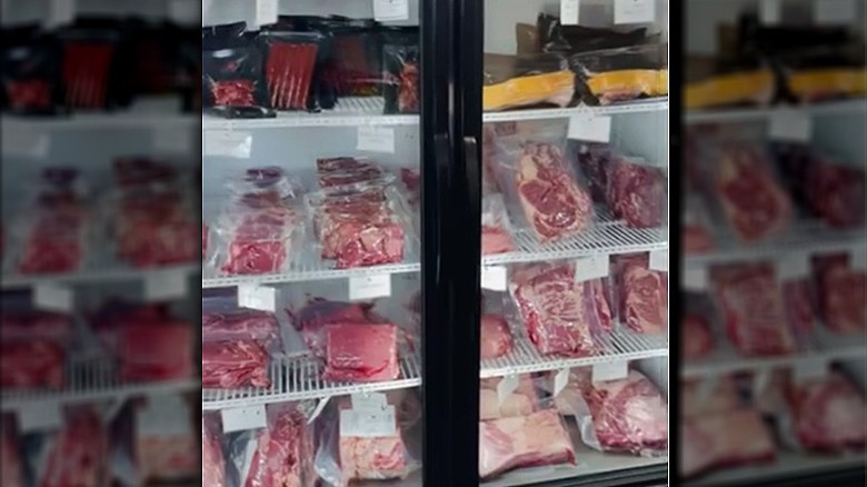 Refrigerated case full of fresh cut meat.